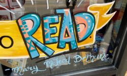 The front window of Mystery to Me Books in Madison, Wisconsin, that proclaims: "Read!"